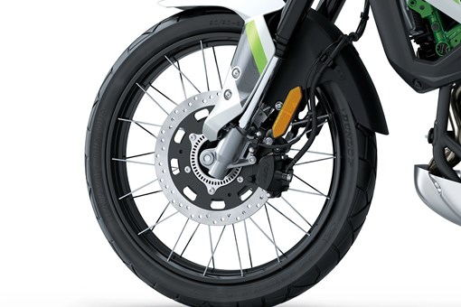 Closeup of a wheel of a motorcycle staged in a white studio background. opens in a new window