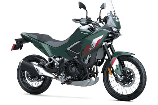 Three-quarter front angle of a gray/green motorcycle staged in a white studio background. opens in a new window