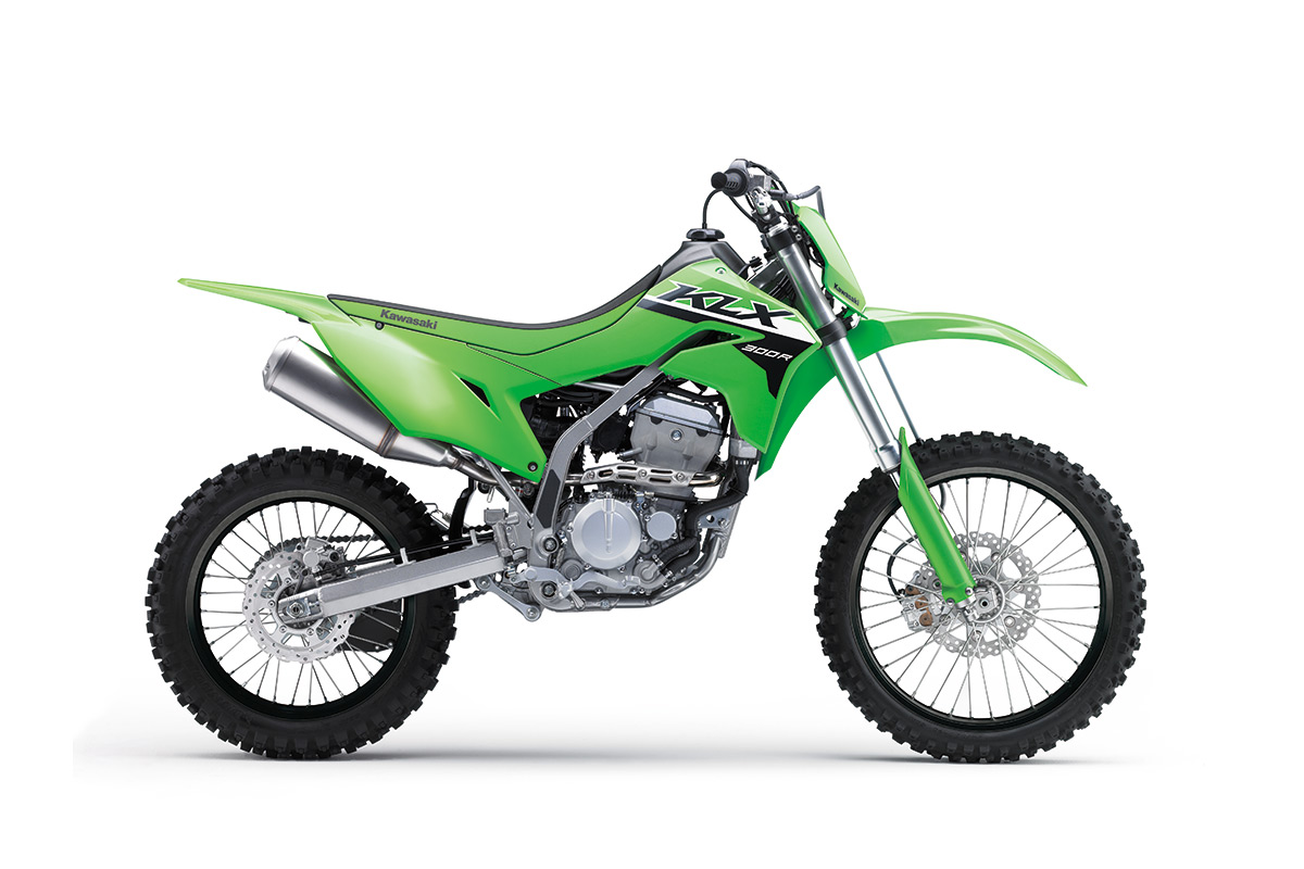 Profile angle of a green motorcycle staged in a white studio background.
