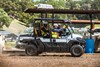 Side angle of a person driving a side x side off-road.
