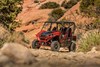 Three-quarter front angle of side x side parked off-road.