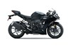 Profile angle of a motorcycle staged in a white studio background.
