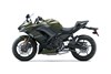 Profile angle of a dark green motorcycle staged in a white studio background.