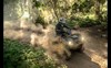 Overhead angle of a person riding an ATV off-road.