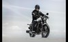 Front angle of a person riding a motorcycle.