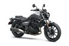 Three-quarter front angle of a gray motorcycle staged in a white studio background.