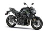 Three-quarter front angle of a black motorcycle staged in a white studio background.