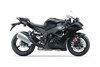 Profile angle of a motorcycle staged in a white studio background.