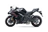 Side angle of a motorcycle staged in a white studio background.