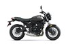 Profile angle of a motorcycle staged in a white studio background.