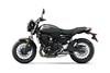 Side angle of a motorcycle staged in a white studio background.