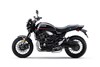 Side angle of a motorcycle staged in a white studio background.
