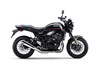 Profile angle of a motorcycle staged in a white studio background.