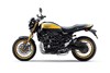 Side angle of a motorcycle staged in a white studio background.