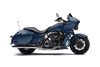 Profile angle of a motorcycle staged in a white studio background.