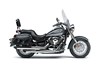 Profile angle of a motorcycle staged in a white studio background.
