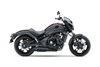 Profile angle of a motorcycle staged in a white studio background.