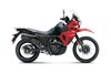 Side angle of a red motorcycle staged in a white studio background.