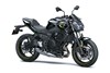 Three-quarter front angle of a black motorcycle staged in a white studio background.