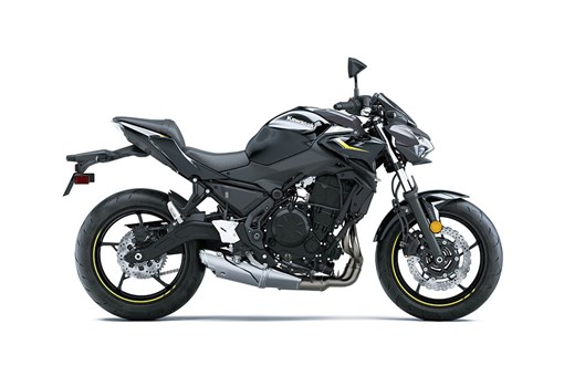 Profile angle of a black motorcycle staged in a white studio background. opens in a new window