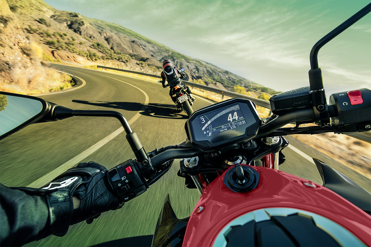 Rider point of view on a motorcycle on a road.