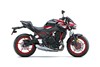 Profile angle of a motorcycle staged in a white studio background.
