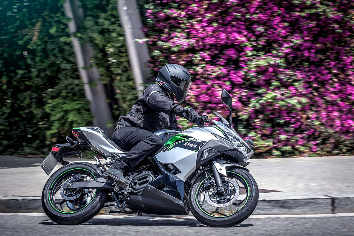 Side angle of a person on a motorcycle making a turn.