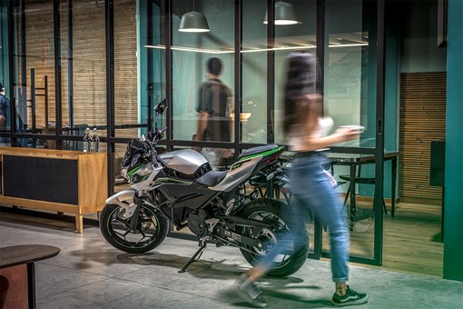 Side angle of motorcycle staged in an office building. opens in a new window