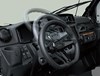 Three-quarter rear angle of a side x side's steering wheel being adjusted.