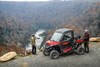 Three-quarter front angle of side x side next to a view overlook.