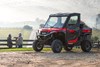 Three-quarter front angle of a side x side parked off-road.