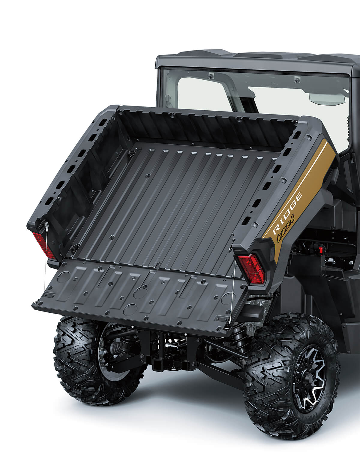 Three-quarter rear angle of a side x side's cargo bed fully lifted.
