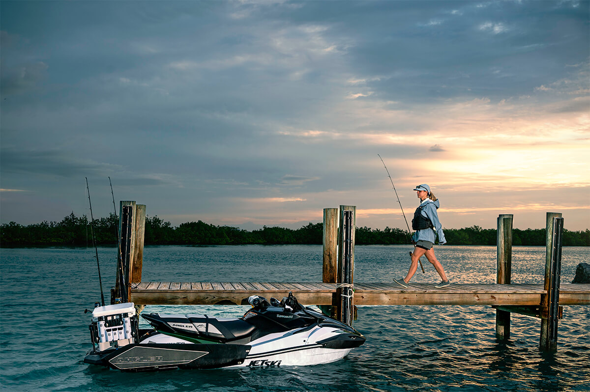 Side angle of a personal watercraft near a dock.