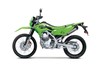 Side angle of a green motorcycle staged in a white studio background.