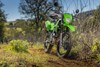Three-quarter front angle of a motorcycle staged off-road.