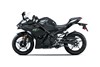 Profile angle of a black motorcycle staged in a white studio background.