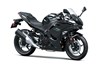 Three-quarter front angle of a black motorcycle staged in a white studio background.