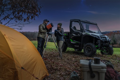 Three-quarter front angle of a side x side parked under stars. opens in a new window