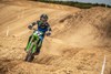 Front angle of a person riding a motorcycle off-road.