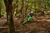Front angle of a person riding a motorcycle off-road.