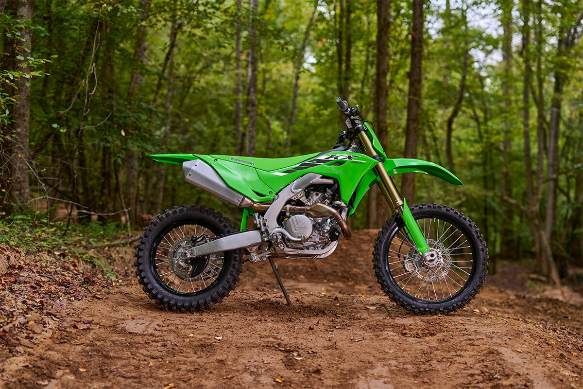 Side angle of a motorcycle parked off-road.