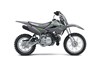 Profile angle of a gray motorcycle staged in a white studio background.