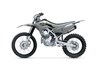  Profile angle of a grey motorcycle staged in a white studio background.