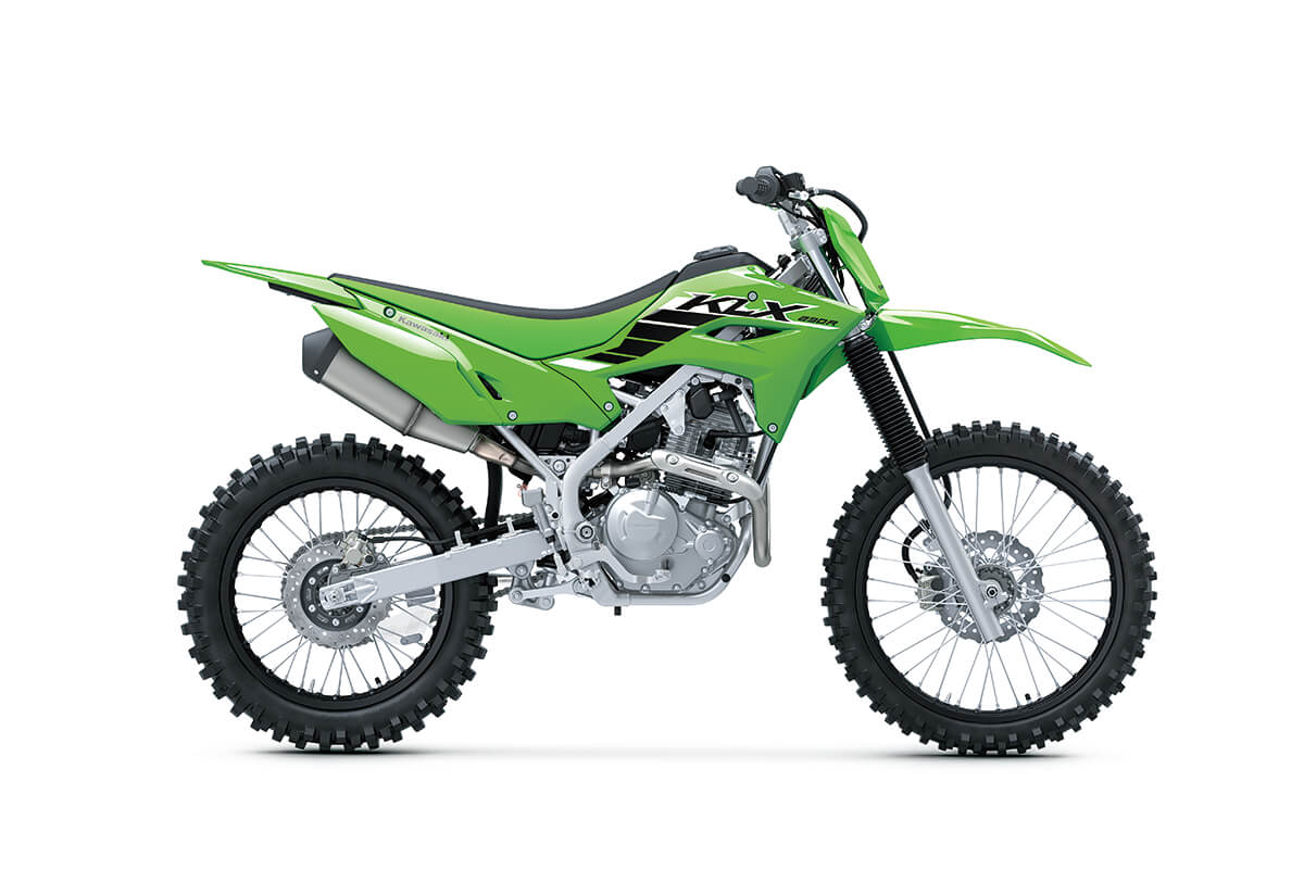  Side angle of a green motorcycle staged in a white studio background.