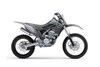Profile angle of a gray motorcycle staged in a white studio background.