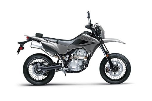 Profile angle of a gray motorcycle staged in a white studio background. opens in a new window