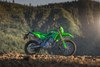Side angle of a motorcycle parked off-road.