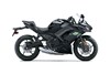 Profile angle of a motorcycle staged in a white studio background.