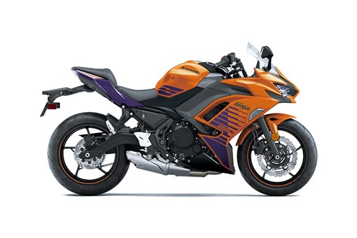 Profile angle of an orange and black motorcycle staged in a white studio background. opens in a new window
