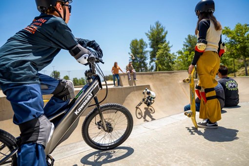 Close up angle of a young adult riding an electric balance bike. opens in a new window